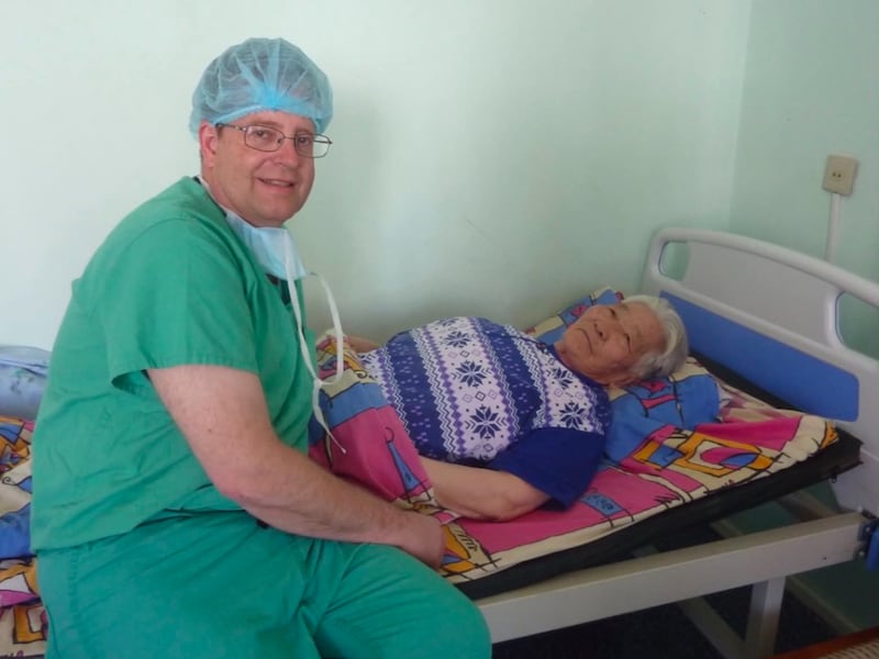 Dr. Raymond R. Price, MD, with an 85 year-old patient after a successful laparoscopic surgery in Mongolia.