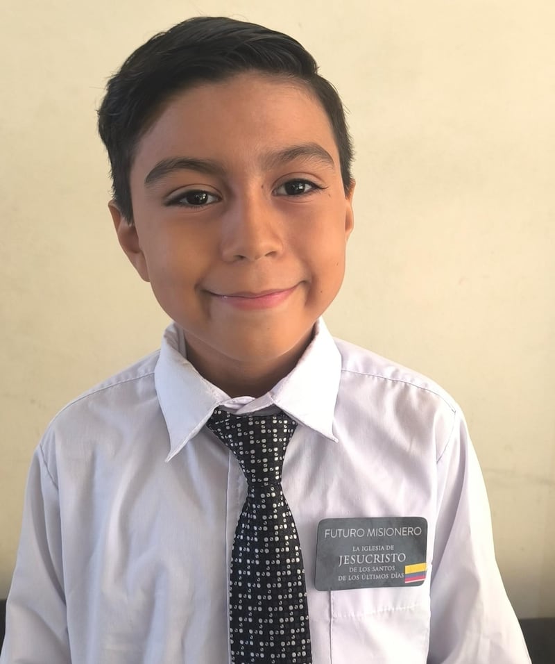 Jorge Mena, 9, smiles for a photo while wearing a "future missionary" name tag after the Samborondón Ecuador Stake Primary's mini missionary training center activity in Guayaquil, Ecuador, Feb. 21, 2026.