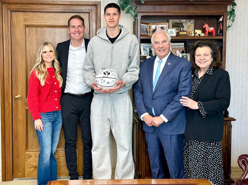 Elder Ronald A. Rasband of the Quorum of the Twelve Apostles and his wife, Sister Melanie Rasband, pose for a picture with Brooklyn Nets guard Egor Dëmin, middle, and LaRee and Travis Hansen, BYU’s senior associate athletic director, at the Church Administration Building in Salt Lake City, Utah, on Jan. 30, 2026.
