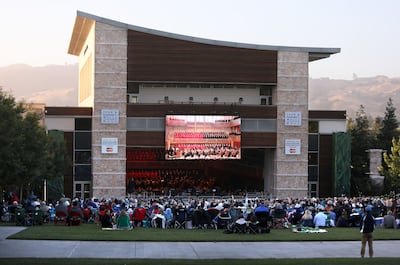 People sit on the lawn outside of Weill Hall for the Mormon Tabernacle Choir and Orchestra at Temple Square concert at the Green Music Center in Rohnert Park, California, on Wednesday, June 27, 2018.