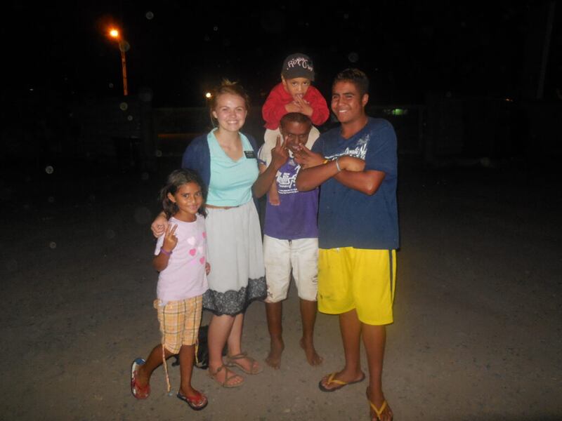 Sister Morgan Taylor enjoys time with young friends while serving in the Tahiti Papeete Mission.