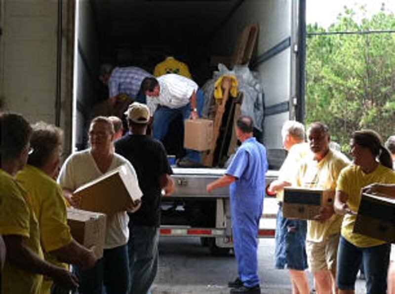 Wearing Mormon Helping Hands shirts, members from the Harkers Island Ward, Kinston North Carolina St