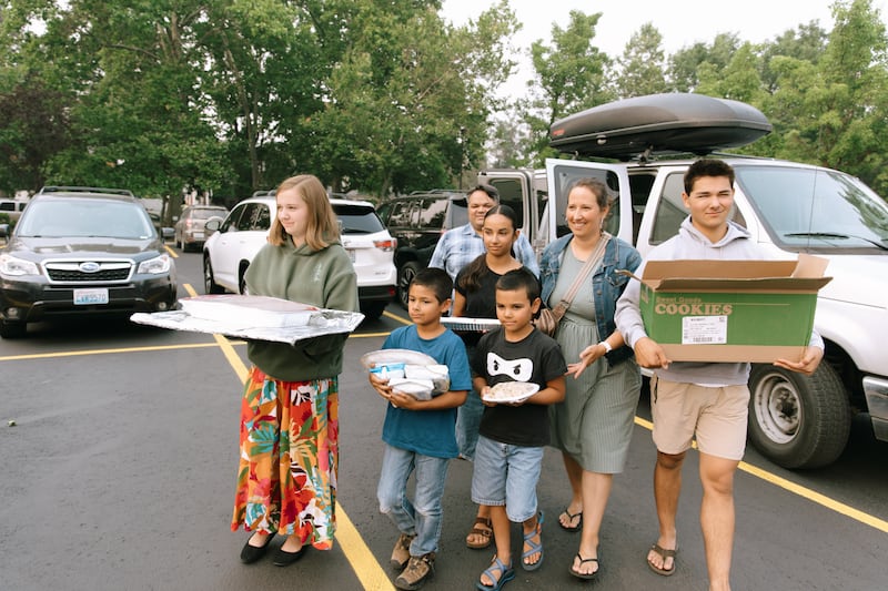 Members of the Spokane Washington Stake bring a meal to the stake center for people affected by the wildfires in Spokane, Washington, on Aug. 2, 2026.