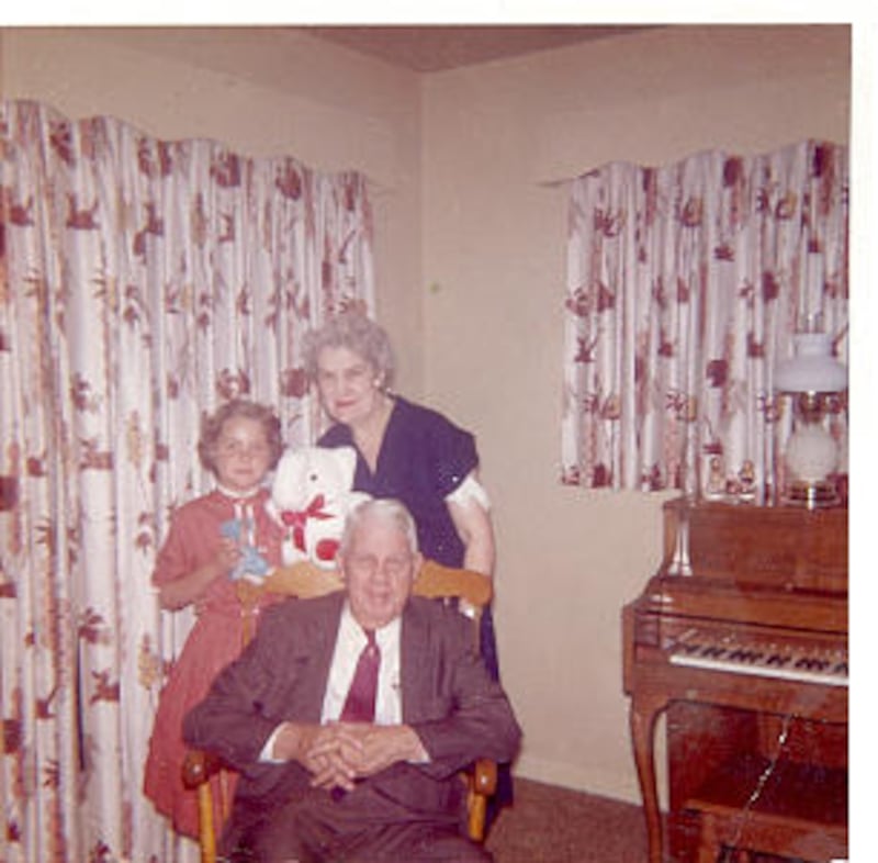 Linda Kjar, age 8, pictured with her Grandpa and Grandma Kjar. Her grandpa was the source of many be