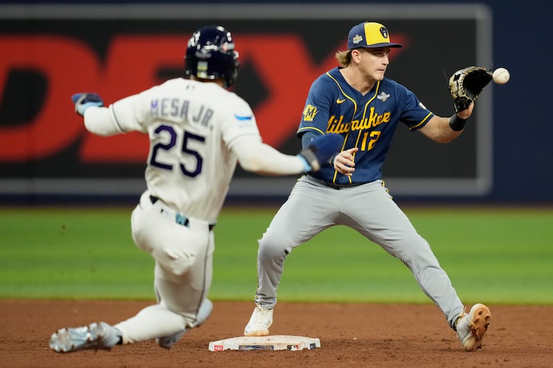 Milwaukee Brewers shortstop Cooper Pratt forces Tampa Bay Rays' Victor Mesa Jr. out at second after Nick Fortes hits into a double play during the sixth inning of Game 3 of baseball's World Series, Monday, Oct. 26, 2026, in St. Petersburg, Florida, between the Milwaukee Brewers and the Tampa Bay Rays.