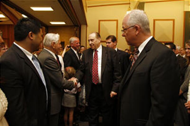 President Thomas S. Monson greets members after speaking at a sacrament meeting for the Etobicoke an
