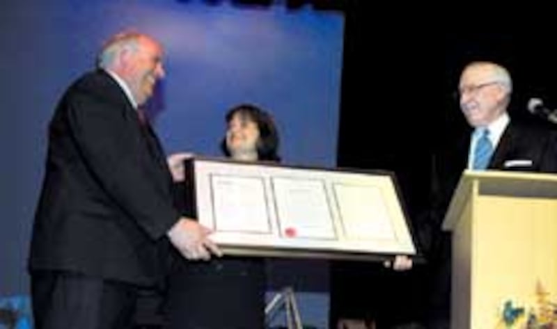 Pres. James E. Faust presents award to Pres. Scott Lorimer and his wife Dee.