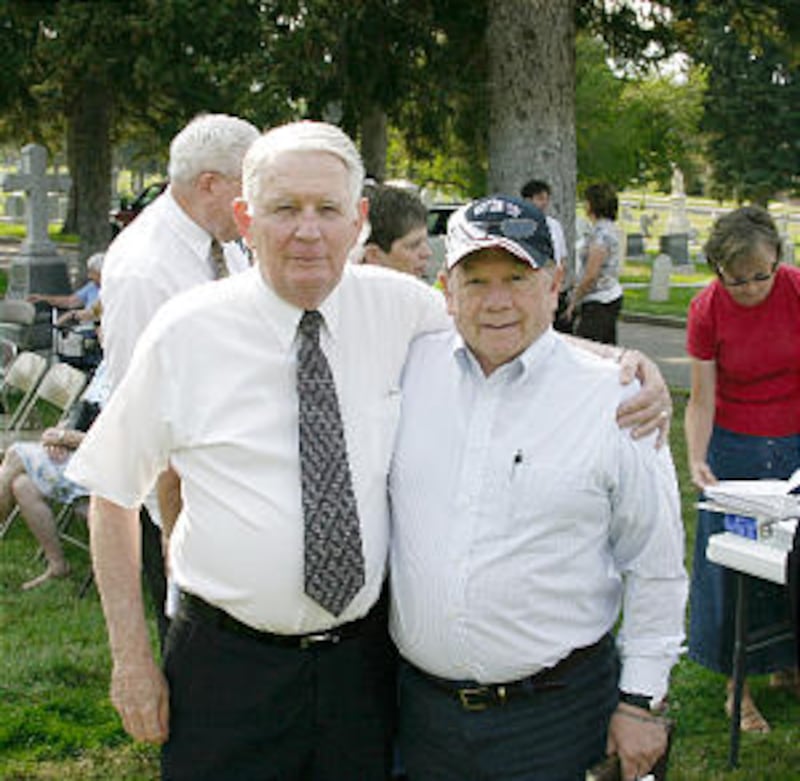 Darrell Knight, left, head of Knight family organization, stands with William G. Hartley, historian