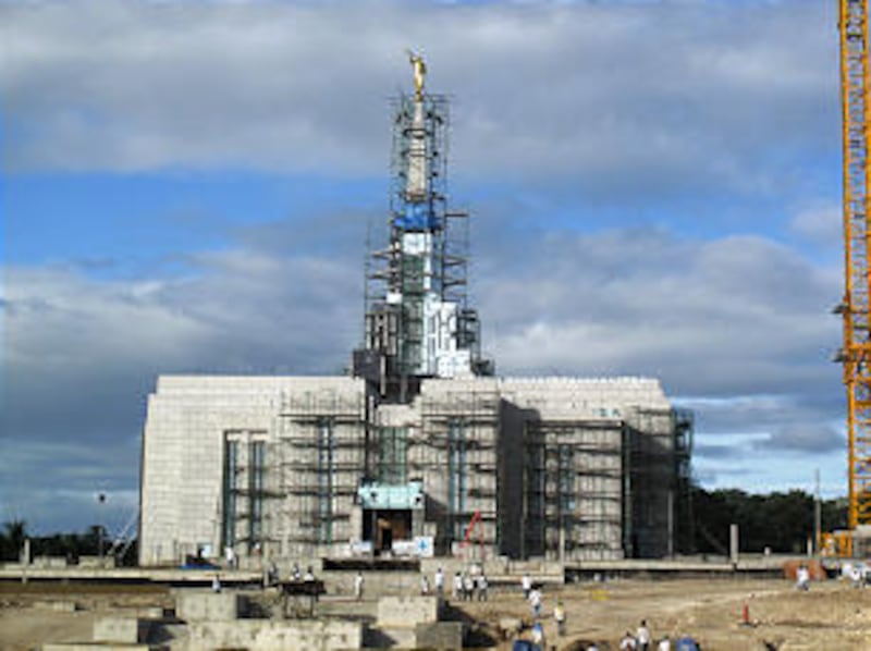 The statue of Moroni rests high atop the Cebu Philippines Temple after in was placed on the second t