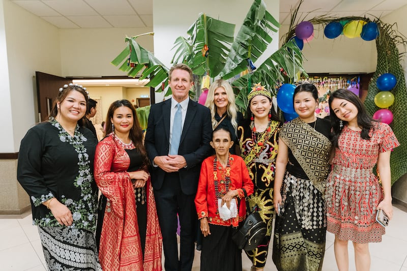 Young Men General President Timothy L. Farnes and his wife, Sister Linsey Farnes, stand for a photo with youth during a Gawai harvest festival in Sibu, Malaysia, as part of a ministry assignment to countries in Asia, May 21-31, 2026.