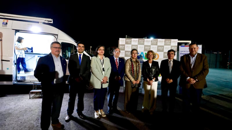 Local health and government officials join Church leaders in front of a health van in the parking lot of the Iquique Chile Stake Center in Iquique, Chile, in July 2026.