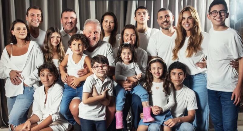 Brazilian soccer star poses for a family photo with his wife, children and grandchildren.