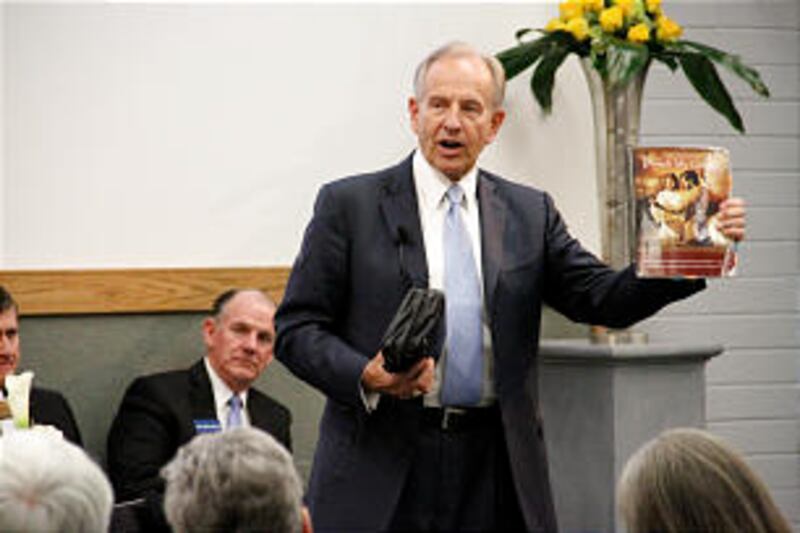 Elder W. Craig Zwick displays what he says are the tools that should be used in teaching missionarie