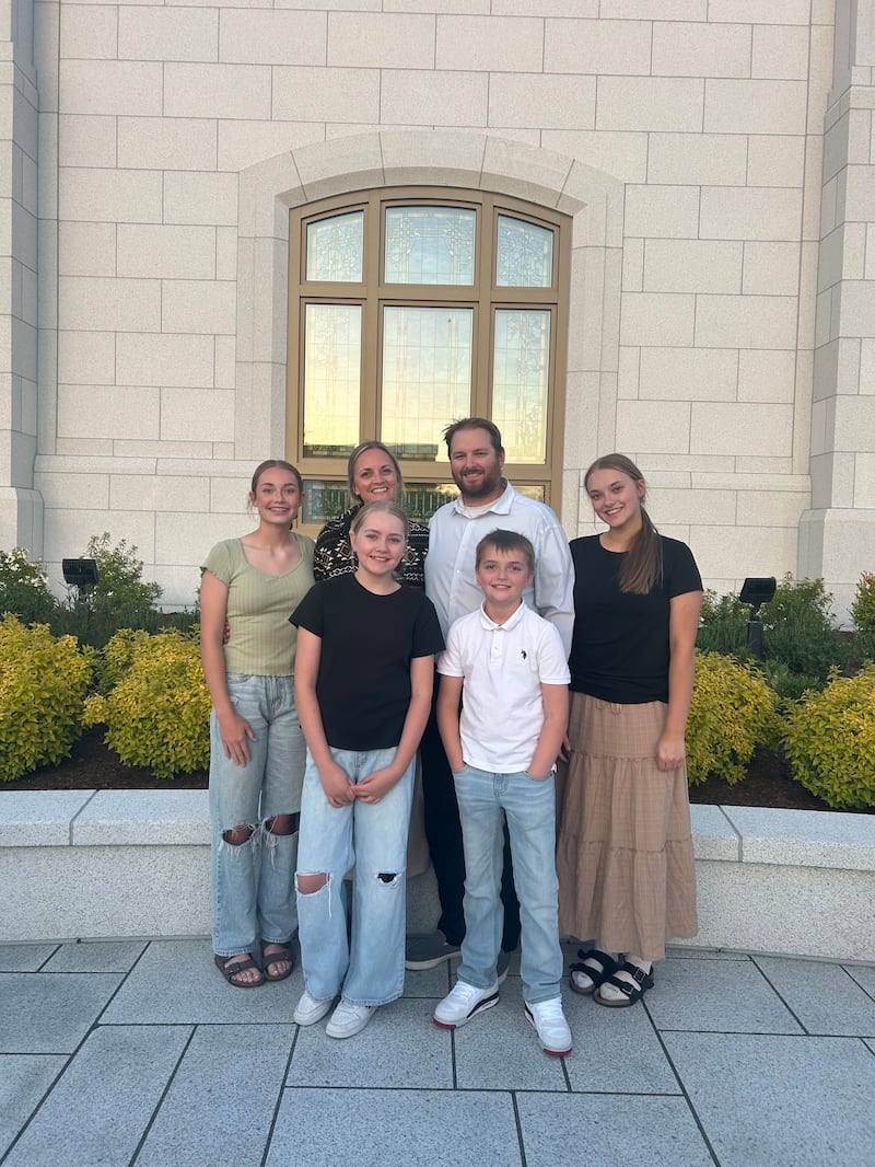 The Moon family of the Springfield Oregon Stake stands in front of the Willamette Valley Oregon Temple.