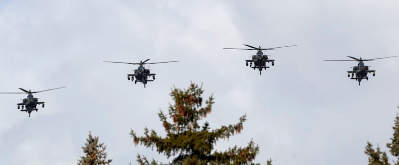Apache helicopters fly over graveside services for Chief Warrant Officer 2 Kirk T. Fuchigami Jr. at the Brigham City Cemetery on Monday, Dec. 9, 2019. Fuchigami and his co-pilot died when their helicopter crashed as they provided security for troops on the ground in Logar Province in eastern Afghanistan.