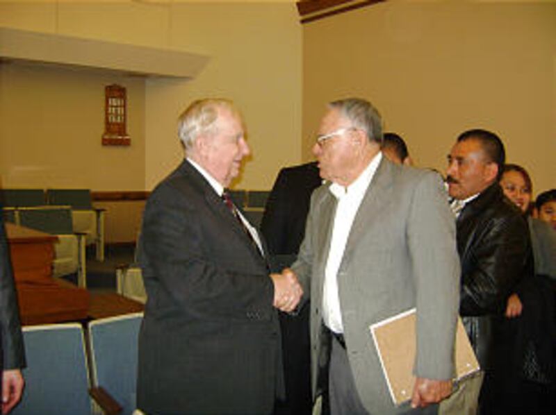 Elder Richard G. Scott of the Quorum of the Twelve visits with Antonio Camino, from the Las Colinas