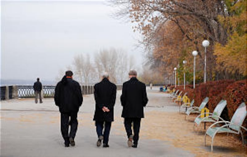 Elder Russell M. Nelson (center) with Elder Gregory A. Schwitzer (right) and President Randall K. Be