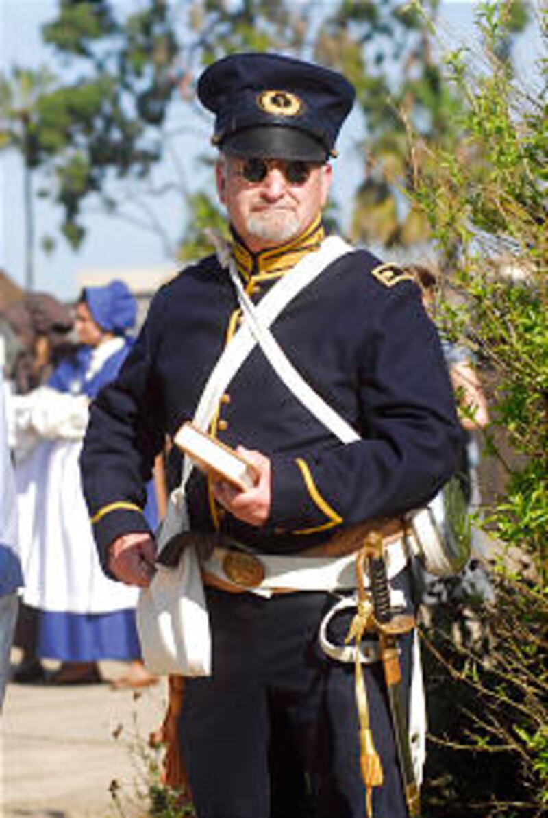 Roger Miller dresses as battalion chaplain in annual parade.