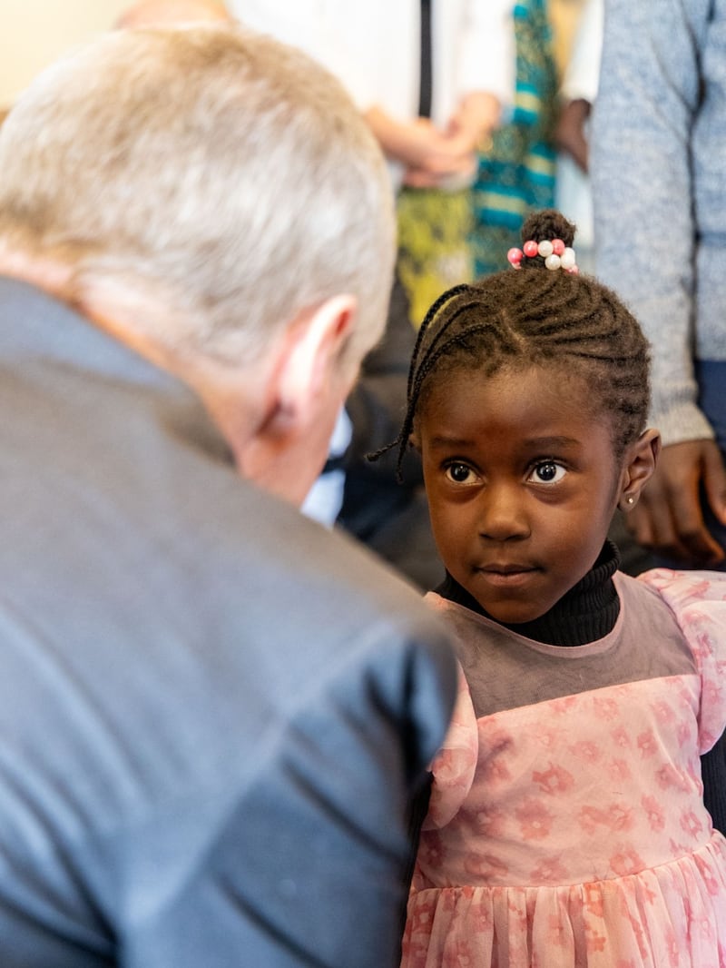 Elder David A. Bednar greets a young girl in Nairobi, Kenya, Sunday, March 22, 2026.