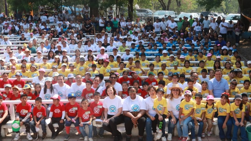 President Susan H. Porter and Tracy Y. Browning take a group photo with dozens of children, members of the Church and their friends all wearing JustServe shirts while participating in a service activity in Tuxtla Gutiérrez, Chiapas, Mexico, on May 16 2026.