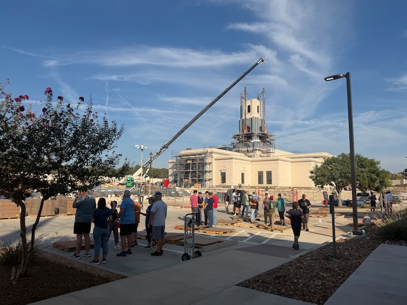 Latter-day Saint volunteers work outside the under-construction Austin Texas Temple as they unload 40,000 pounds of food donated by the Church to go to local food pantries in Cedar Park, Texas, on Wednesday, Sept. 23, 2026.