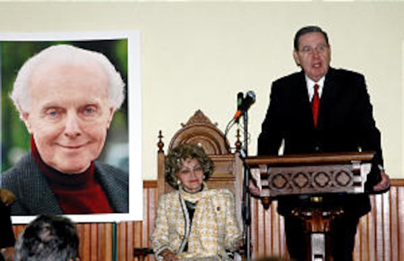 Elder Jeffrey R. Holland speaks at the Tom Lantos tribute, with Annette Lantos looking on.