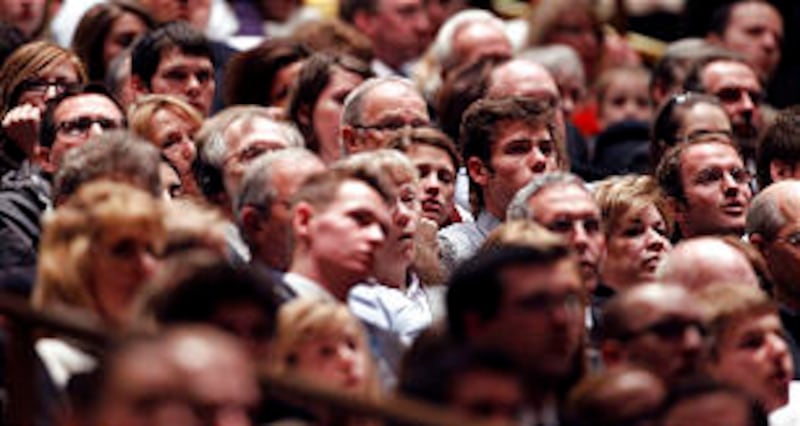 Audience members listen during the First Presidency's Christmas Devotional Sunday, Dec. 4, 2011.