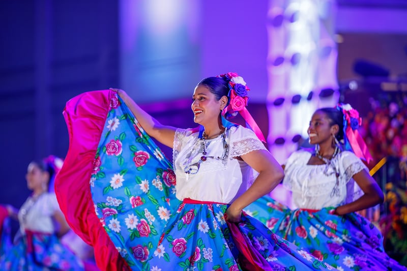 Dancers wearing traditional dress perform dances from across Latin America during a dress rehearsal of "Luz de las Naciones" in Salt Lake City, Utah, Nov. 3, 2025.