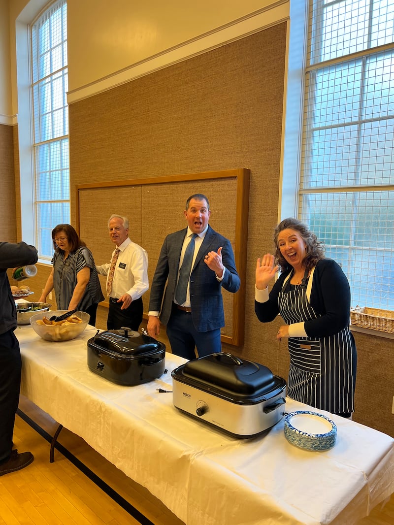 Institute leaders serve food at a weekly dinner at the Cambridge Massachusetts Institute of Religion building on Wednesday, March 25, 2026.
