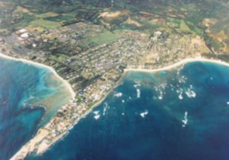 In aerial photo of Laie, one can see campus and Polynesian Cultural Center in middle left, where onc