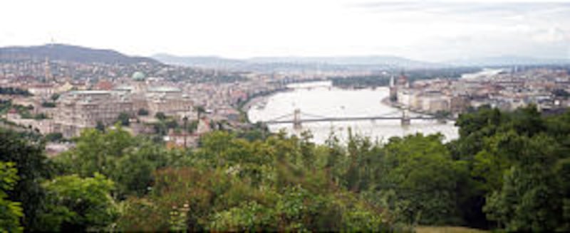 Panoramic view of city divided by Danube River shows Buda on left and Pest on right; cities were uni