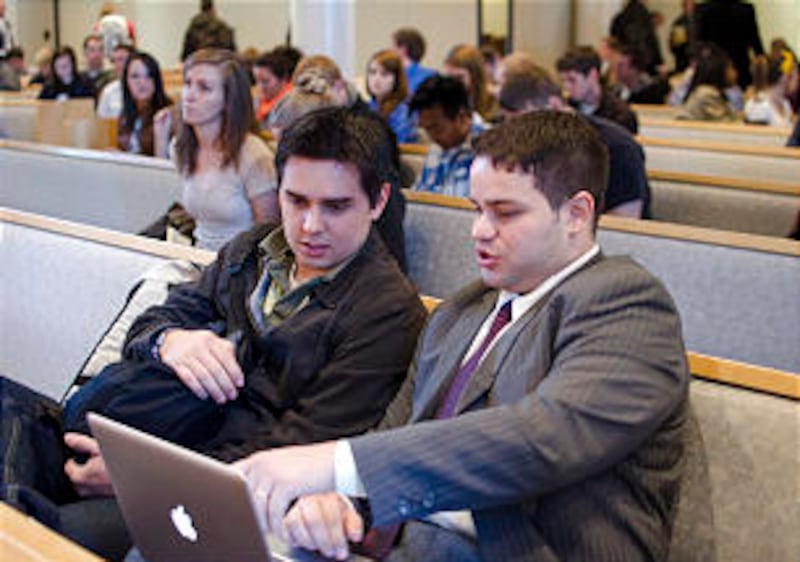 Students in the College of Communication and Business chat between sessions of a seminar. Many diff