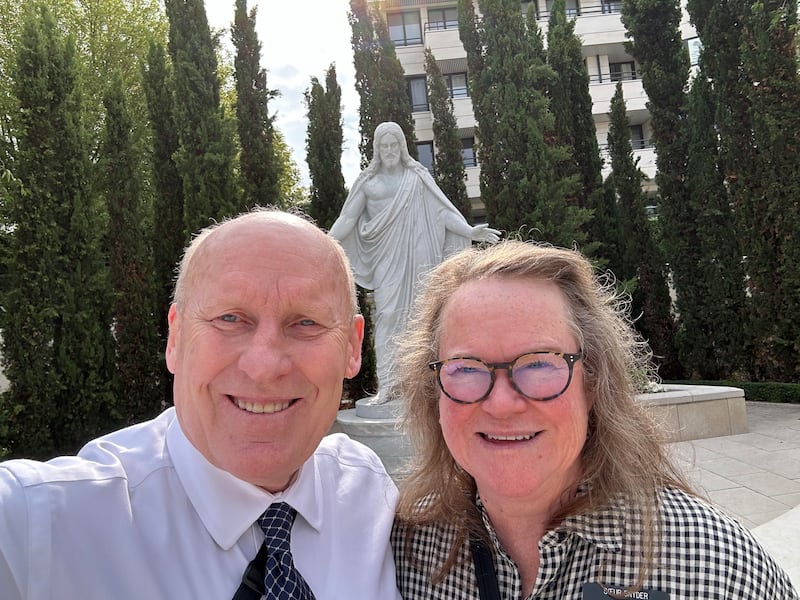 Phil Snyder and Delys Snyder take a selfie on the Paris France Temple grounds.