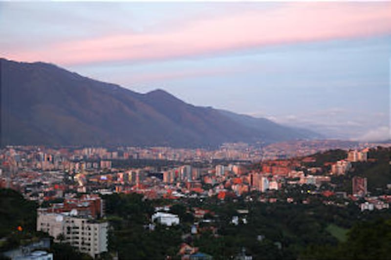 The sky reflects bright colors over Caracas, Venezuela, a country with some 150,000 members, four mi