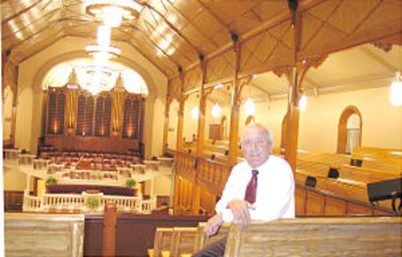 Pres. Frank Crawford in refurbished paris Idaho tabernacle, built in 1889 and rededicated after bein