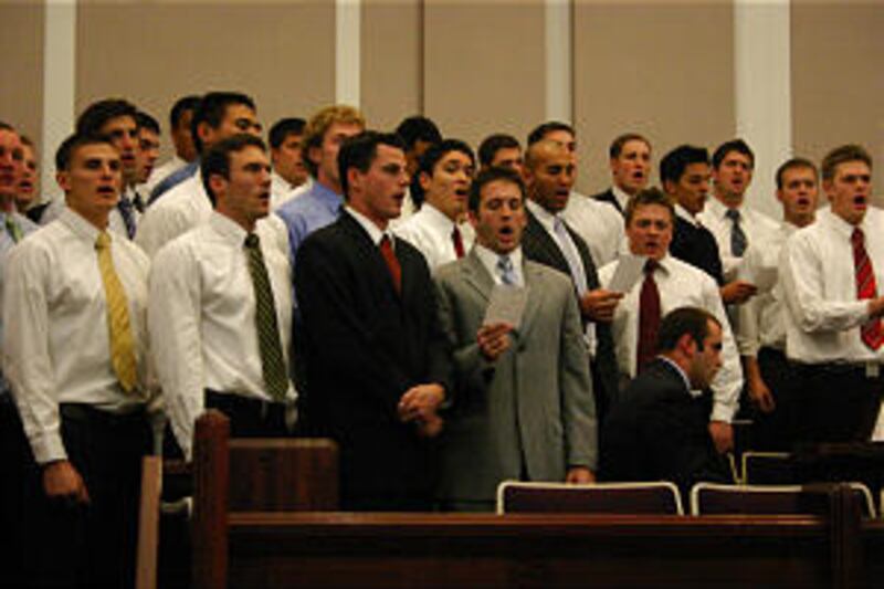Members of the BYU football team sing "Army of Helaman" during fireside the night before Las Vegas B