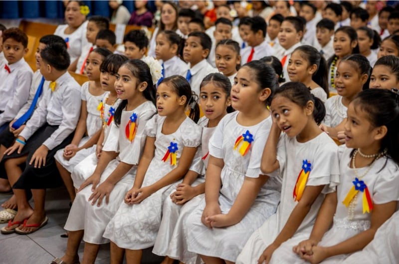 Members of a children’s choir prepare to perform at a special stake conference with Elder Gary E. Stevenson of the Quorum of the Twelve Apostles in Pago Pago, American Samoa, on May 24, 2026.