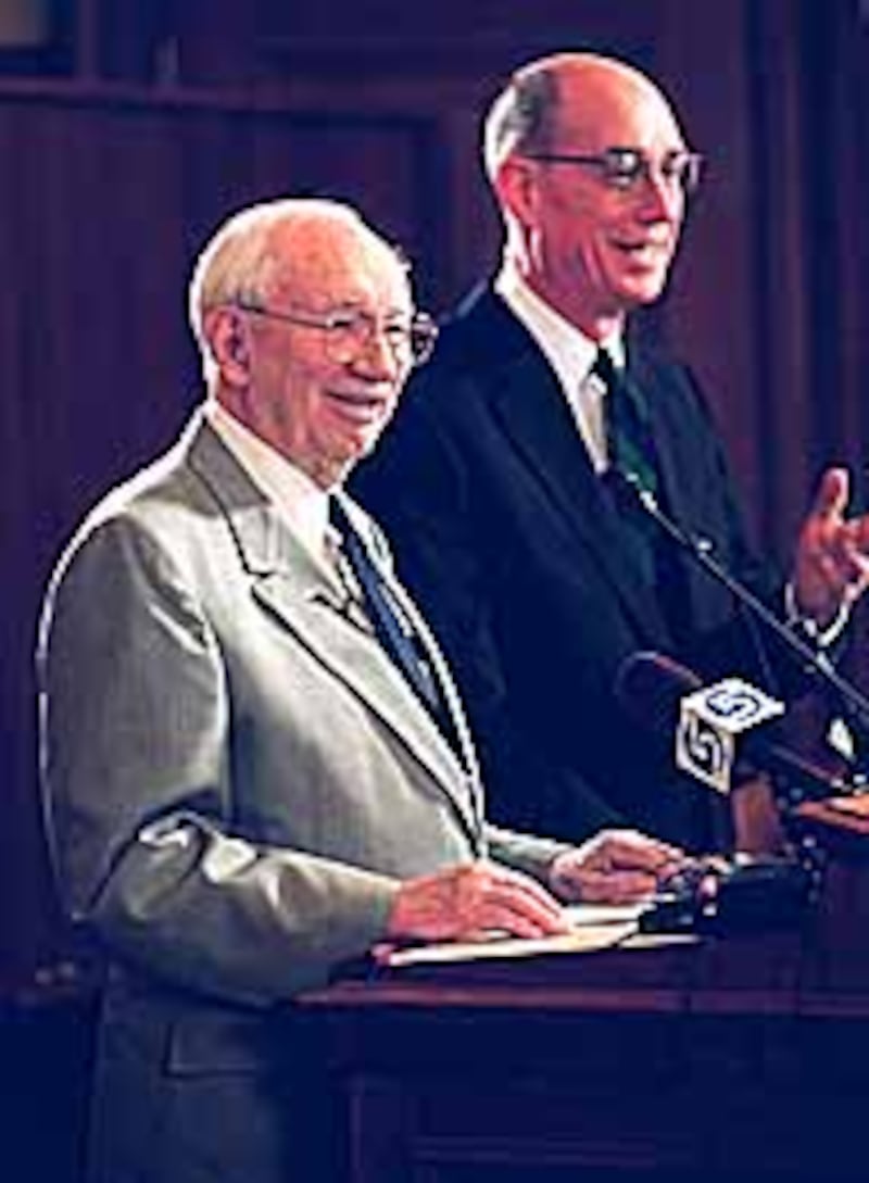 President Gordon B. Hinckley is joined by Elder Henry B. Eyring of the Quorum of the Twelve and Comm