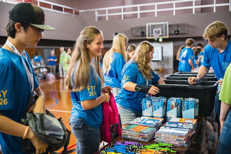 Young men and young women put together hygiene kits for families in need as part of a For the Strength of Youth conference for English-speaking youth in Okinawa, Japan, in June 2026.