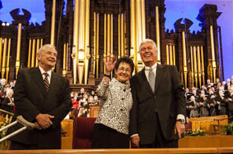 President Dieter F. Uchtdorf and Sister Harriet Uchtdorf stand with Robert H. Garff, President of th