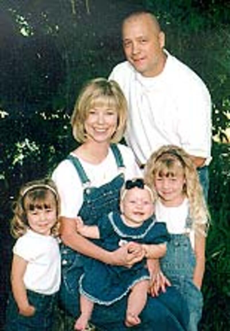 Prior to beginning a tour of duty overseas, Craig Bellow had this photo taken with his wife, Trish,