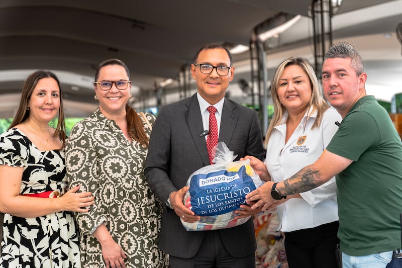 Elder Harold Truque, an Area Seventy from Cali, Colombia, center; stands with officials from the Cali mayor's office, presenting the Church's donation of 1,000 food kits for the benefit of earthquake victims in August 2026.