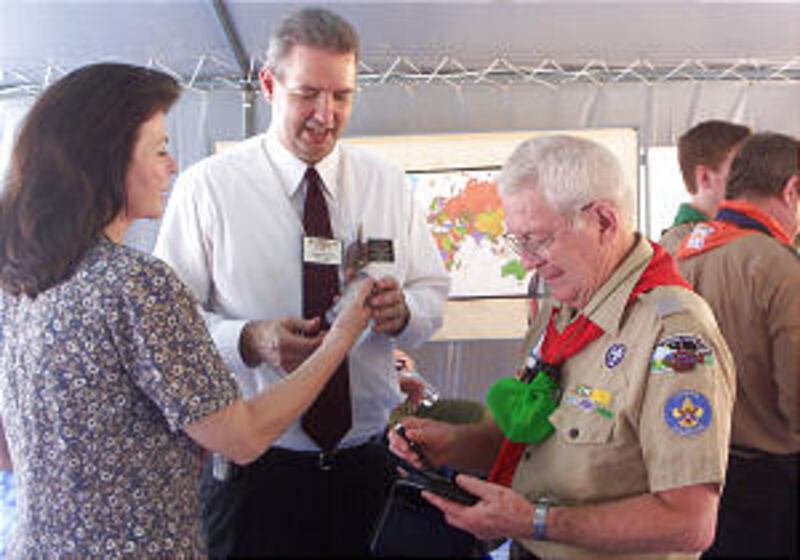 Sister Jennifer Slater and President Martin R. Slater visit Church's display tent in Jamboree's Pray