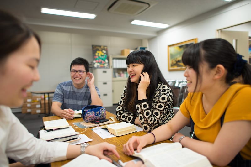 Institute students laugh together during a class held in Nagoya, Japan.
