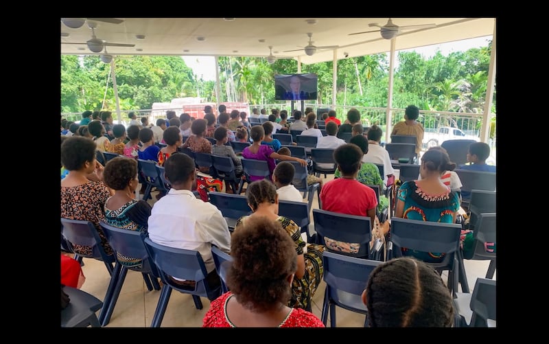 Latter-day Saints in Papua New Guinea gather to watch a broadcast at one of the Church's new simplified meetinghouses designed to bring the Church's program to the remotest areas in the Pacific.