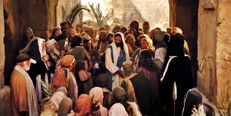 A portrayal of Christ riding into Jerusalem on Palm Sunday.