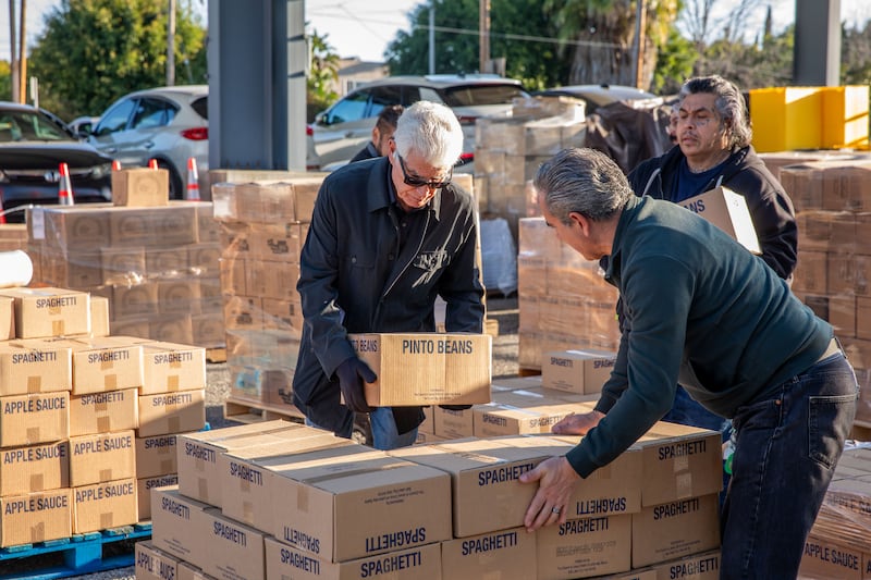 Workers organize food donated by The Church of Jesus Christ of Latter-day Saints in Los Angeles, California, on Thursday, Jan. 29, 2026. A semitruck full of food was delivered to several missions as part of a larger donation to 250 food banks across the country in celebration of the 250th anniversary of the United States.