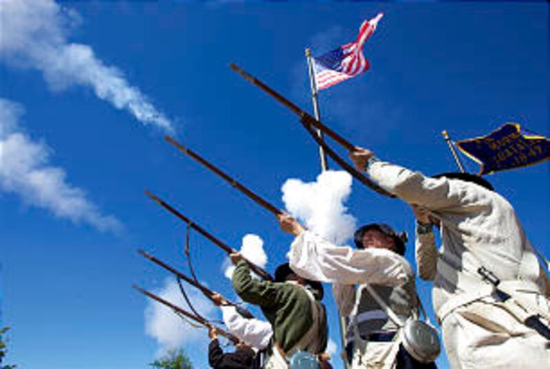 Mormon Battalion reenactment fires rifles in honor of the new monument.