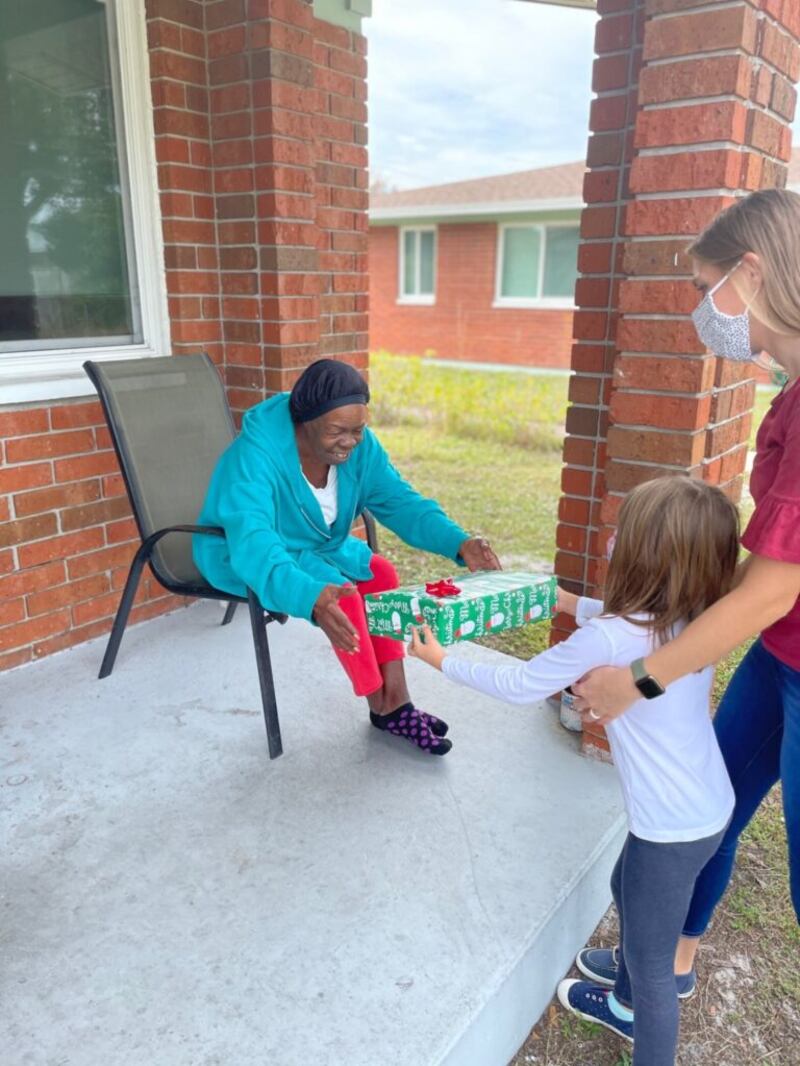 Brinley Baird delivers Christmas gifts to Aging Matters recipients in December 2020. Aging Matters is the leading agency for senior services in Brevard County in Florida.