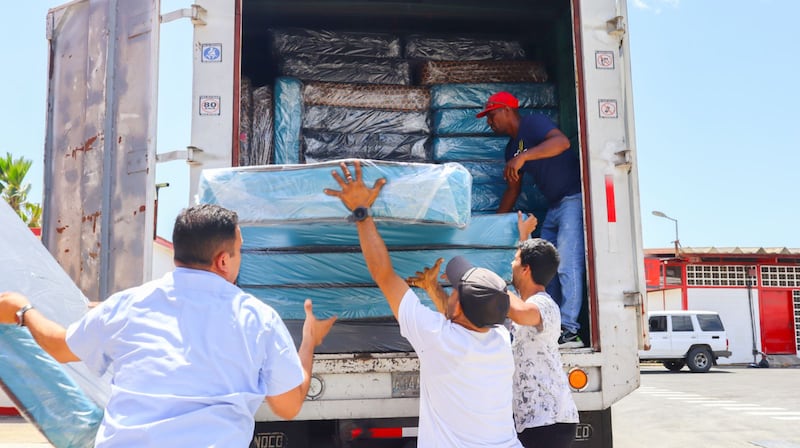 Members of The Church of Jesus Christ of Latter-day Saints load mattresses into a truck as part of the emergency and humanitarian response after deadly earthquakes in Venezuela in La Guaira, Venezuela on July 1, 2026.